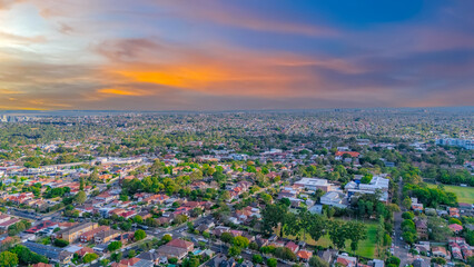 Aerial Panorama Drone View of a inner western Sydney Suburb of Ashbury Urban Sprawl and the terracotta roof tops streets and trees of Suburban Sydney  NSW Australia