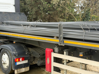 Steel rebar bundles ready for delivery on flatbed truck