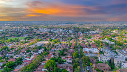 Aerial Panorama Drone View of a inner western Sydney Suburb of Ashbury Urban Sprawl and the terracotta roof tops streets and trees of Suburban Sydney  NSW Australia