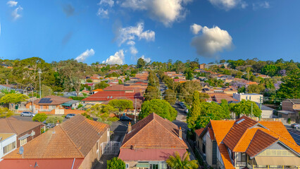 Aerial Panorama Drone View of a inner western Sydney Suburb of Ashbury Urban Sprawl and the terracotta roof tops streets and trees of Suburban Sydney  NSW Australia