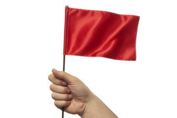 A hand holds a vibrant red flag waving against a stark black background.