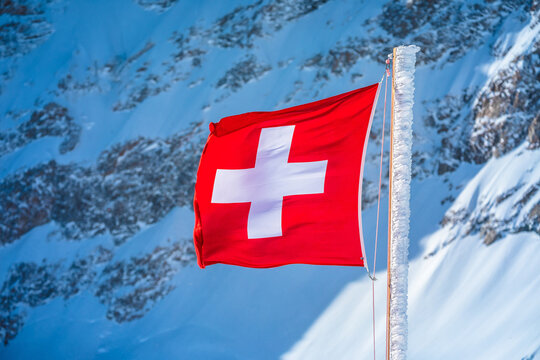 Swiss flag on Jungfraujoch mountain peak view