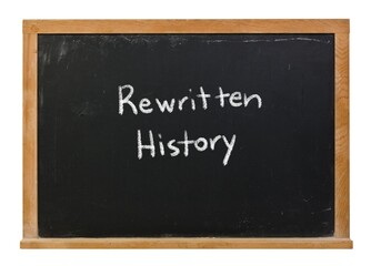 Rewritten history written in white chalk on a black chalkboard isolated in a wooden frame