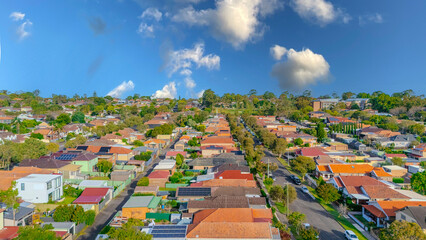 Aerial Panorama Drone View of a inner western Sydney Suburb of Ashbury Urban Sprawl and the terracotta roof tops streets and trees of Suburban Sydney  NSW Australia
