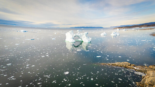 Iceberg reflections in Arctic landscape of Ilulissat