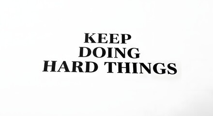 Inspirational quote on a white background encouraging perseverance and dedication with the message 'Keep Doing Hard Things' in bold black text
