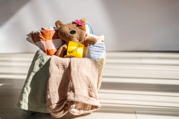 Basket with toys and textiles in natural light