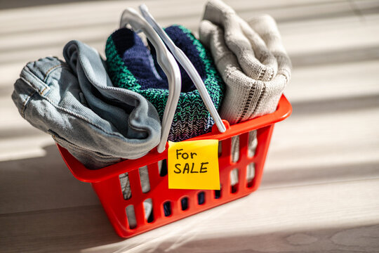 Shopping basket with clothing for sale