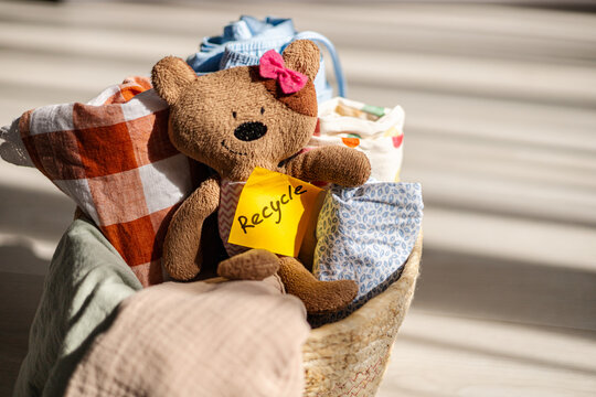 Basket filled with toys and clothes emphasizing recycling