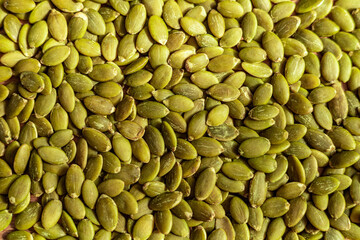 Close up of fresh green pumpkin seeds in abundance