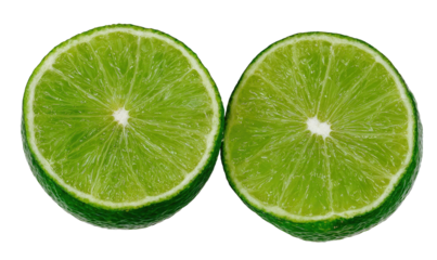 Two bright green citrus halves, vibrant, fresh, on black