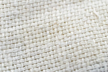 Textured pattern created from white jute fabric.