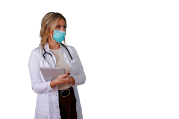 Woman doctor wearing face mask, holding a tablet, standing with stethoscope, healthcare professional