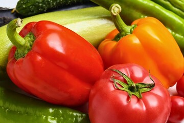 Vibrant assortment of fresh bell peppers and green vegetables
