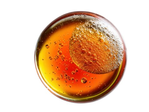 Golden oil drops in circular macro formation.