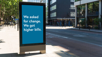 Outdoor billboard with message reading We asked for change we got higher bills