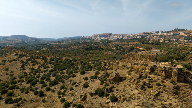 Aerial view of the archaeological area of ​​the Valley of the Temples, located in Sicily, Italy. In background is the city of Agrigento. It's an example of ancient Greek architecture of Magna Graecia.