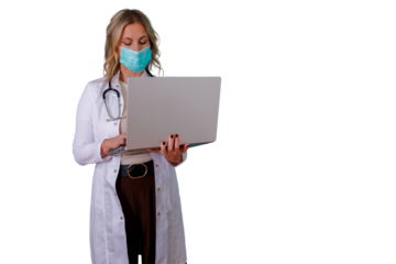 Healthcare professional woman wearing a medical mask and white lab coat holding a laptop, working on digital health and remote medicine