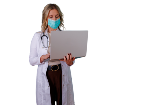 Healthcare professional woman wearing a medical mask and white lab coat holding a laptop, working on digital health and remote medicine