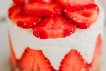 Delicious strawberry dessert with cream and fresh fruit