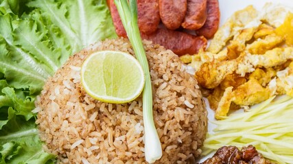Delicious thai fried rice platter with fresh garnishes
