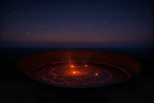 Circular lava pools glowing under a starry night