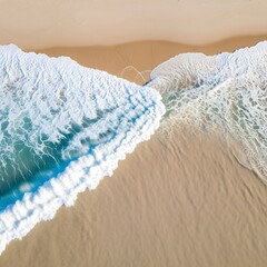 Aerial view of a pristine beach with gentle waves crashing onto the sandy shoreline under clear skies