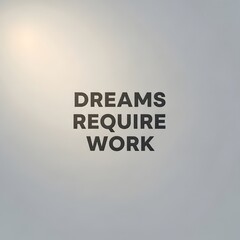 Inspirational quote on a plain wall that reads 'DREAMS REQUIRE WORK' in bold, black capital letters emphasizing motivation and perseverance