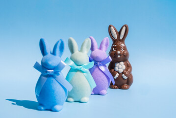 Chocolate Easter bunny with colorful plush figures