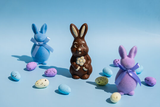 Chocolate bunny with decorative pastel Easter eggs