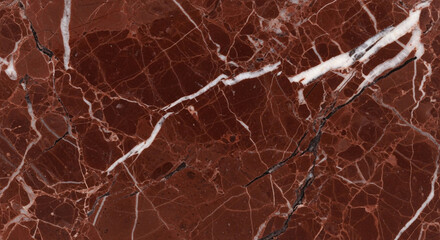 Rich, deep red marble surface with striking white and black veining creates a luxurious, natural texture perfect for elegant interior design projects and sophisticated backgrounds.