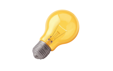 Glowing incandescent light bulb against a black backdrop