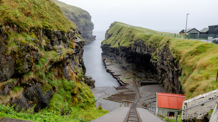 Natural canyon harbor in Gjogv, Eysturoy Island
