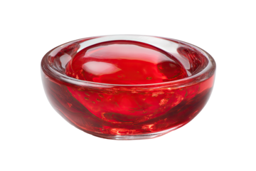 Clear glass bowl holding a large, red, smooth, glistening orb in liquid