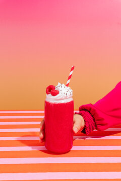 Raspberry smoothie with whipped cream topping