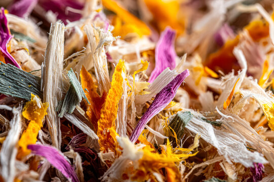 Close-up view of colorful shredded organic biomass waste, highlighting its texture and composition for biofuel applications