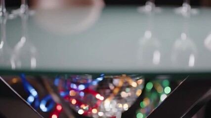 Festive Disco Ball with Colorful Streamers and Bokeh Lights Under Glass Table in 4K