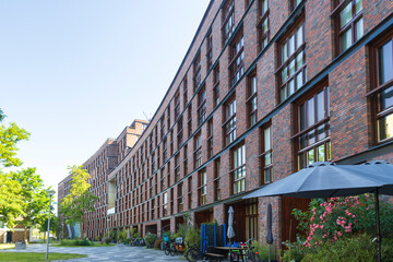 super long and curved facade of residence building  in Funenpark, summer Amsterdam