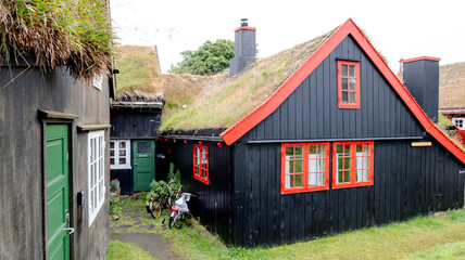 Charming black house with grass roof in Faroe Islands