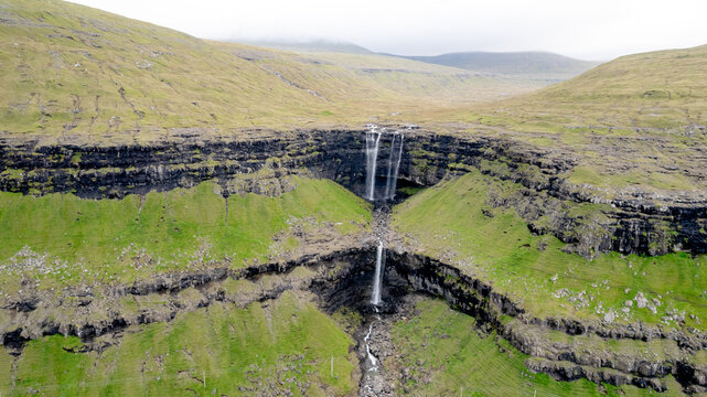 Stunning aerial view of Fossa waterfall in Streymoy Island