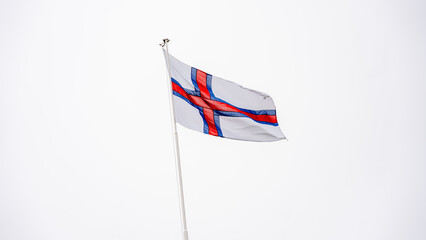Faroe Islands flag waving proudly in the sky