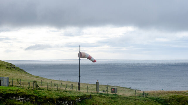 Wind sock on coastal hill in Mykines, Faroe Islands