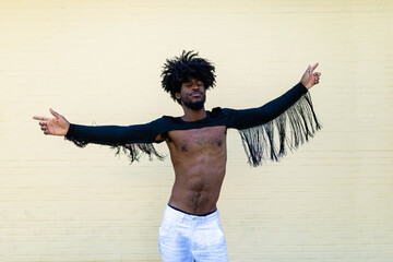 Energetic man with afro hair expressing joy