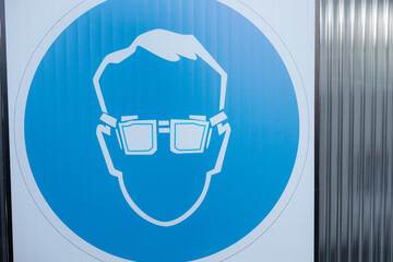 Modern design: a creative blue icon of a person wearing glasses