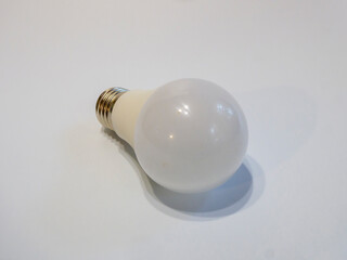 Modern LED Light Bulb Lying on White