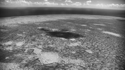 Monochrome aerial perspective of Queensland coral reef showing patterns and natural formations
