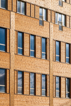 Hard light enhances the facade and amplifies architecture, geometry and contrast in stockholm, blending color, minimalism, urban pattern and modern design into an expressive visual structure