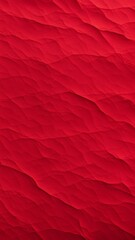 Crumpled red paper texture with soft layered folds and creases, abstract background for design and visual projects.