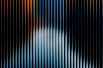 Abstract futuristic background with vertical 3D panels. Glowing light wave of blue, white, and orange on a black striped surface with grain texture.