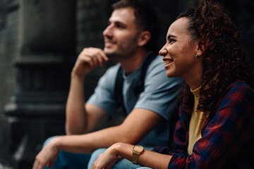 Tourists visiting monument smiling and admiring architecture